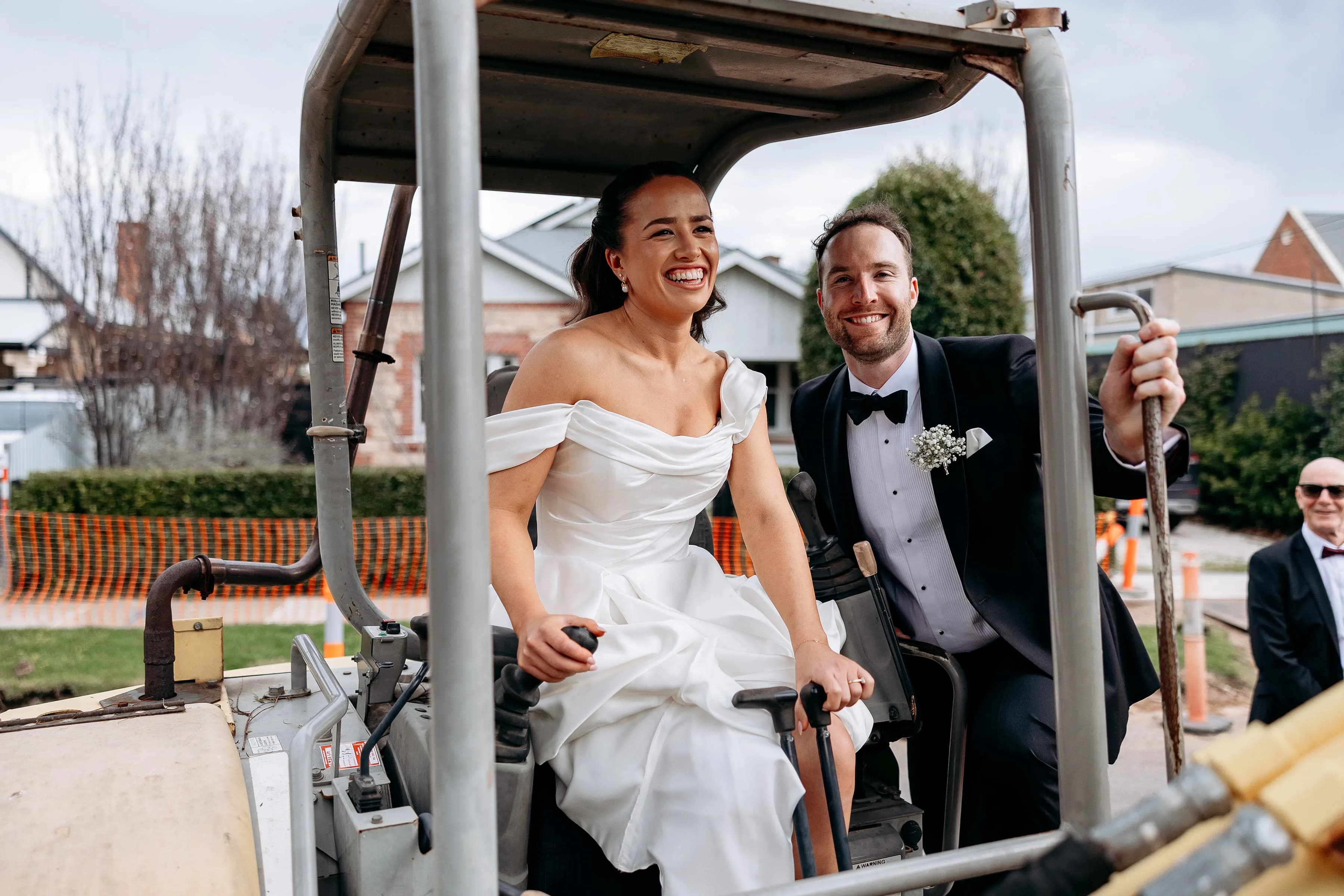 Henry and Elise laughing together on their wedding day